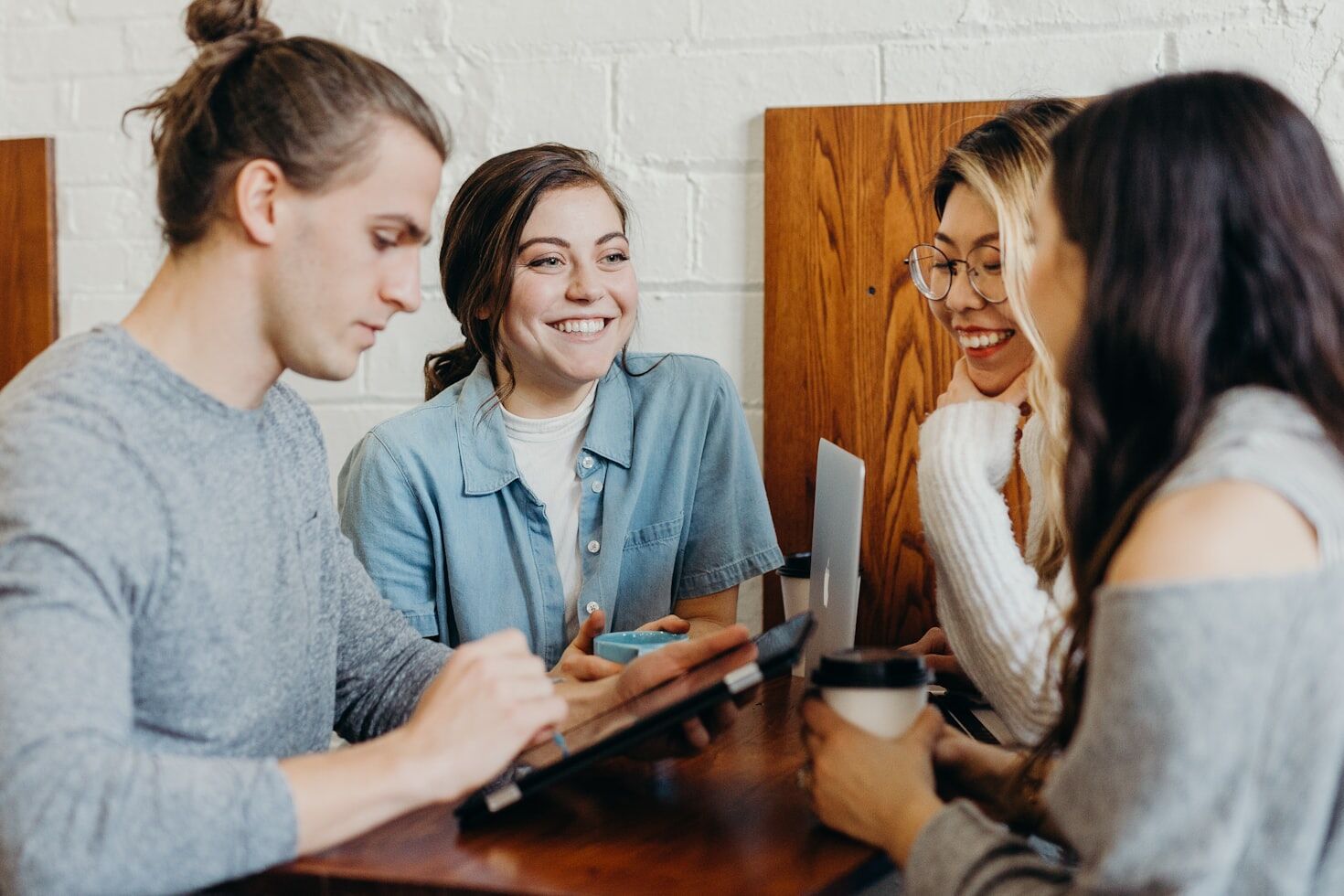 Two people smiling and collaborating, representing meaningful connections.